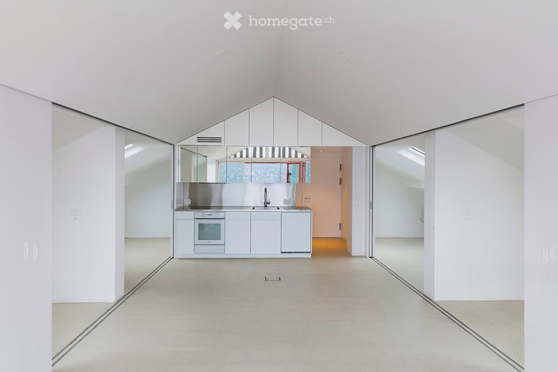 minimalist kitchen with modern appliances, stainless steel countertop, glass doors, white walls, and ceiling