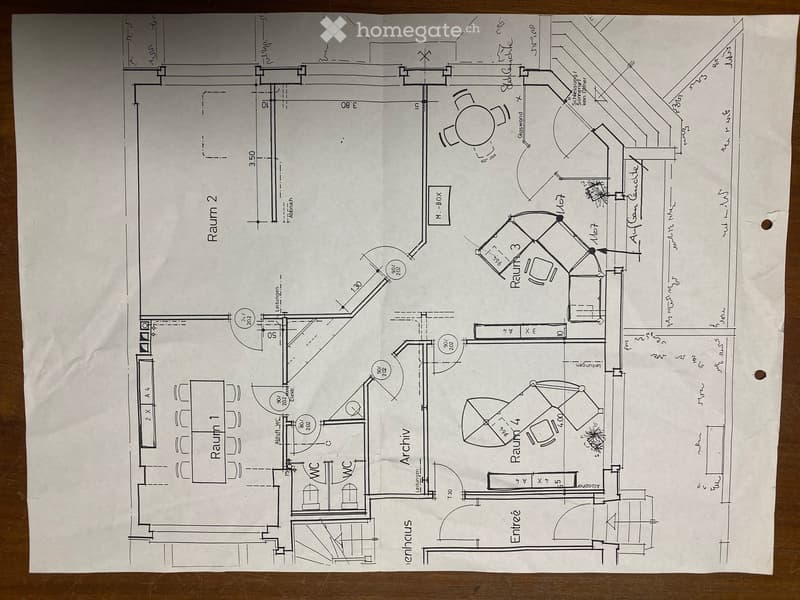 Floor plan showing a layout with four rooms, an entrance, an archive, and two bathrooms.