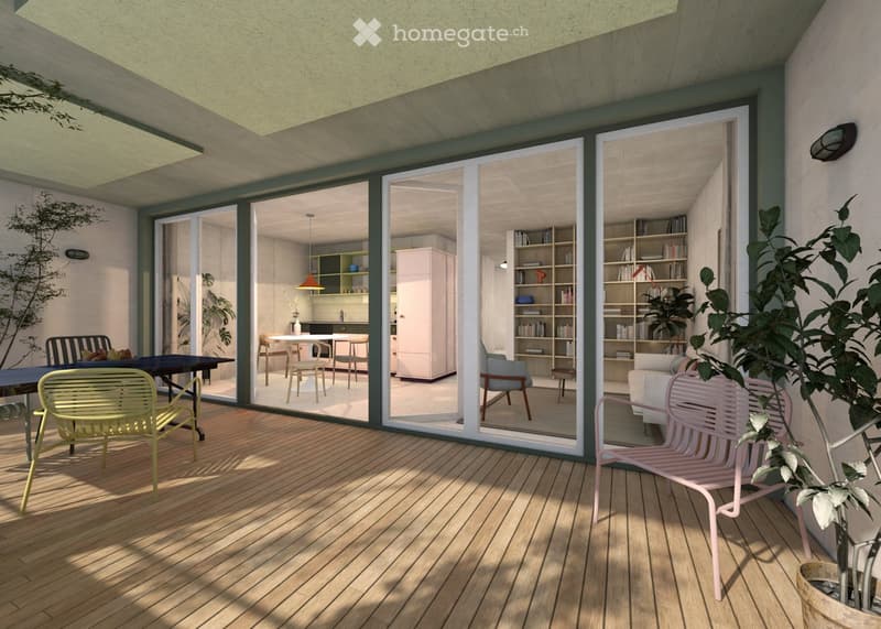 Modern balcony with wooden flooring, large sliding glass doors leading to an interior space, two colorful chairs, and a small table.