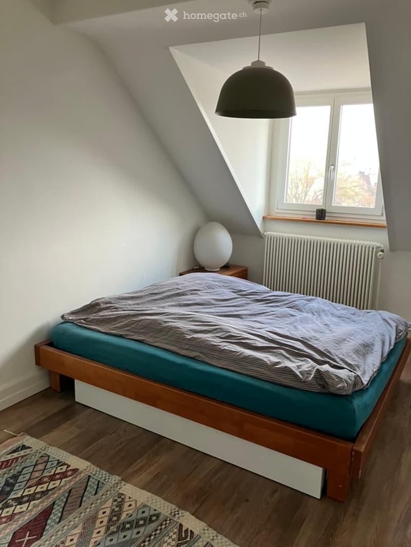 bedroom, bed, wooden flooring, wall lamp, nightstand, carpet, radiator, window