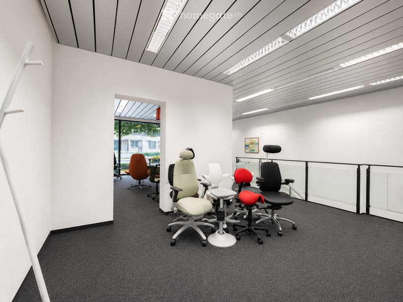 Modern office space with ergonomic chairs, a white stool, and a sleek, minimalist design. The room features a glass partition, white walls, and a grey carpeted floor.