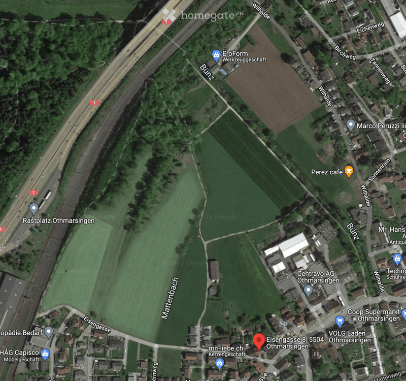 Aerial view of a rural area showing a mix of residential buildings, agricultural fields, and a highway. Key landmarks include a parking area, a cafe, and several named locations such as 'Eisengasse 8, 5504 Othmarsingen' and 'Centravo AG Othmarsingen'.