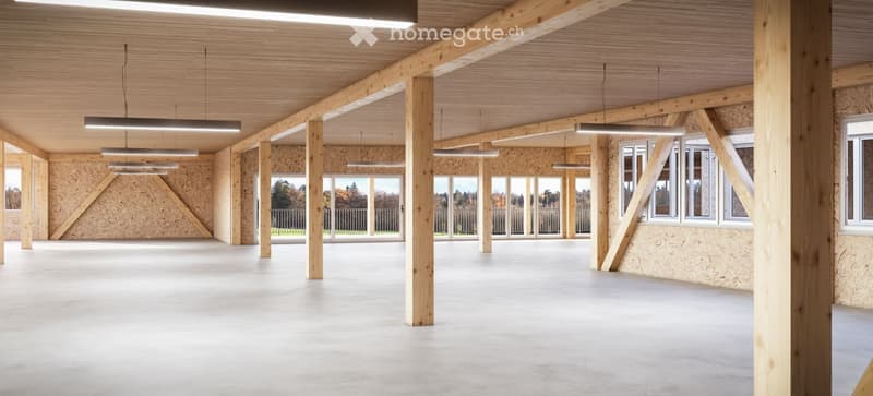 Empty room with exposed wooden beams, concrete floor, and large windows, no furniture or equipment.