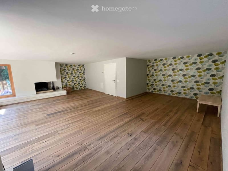 empty room, hardwood floors, white walls, fireplace, decorative wallpaper, ceiling light