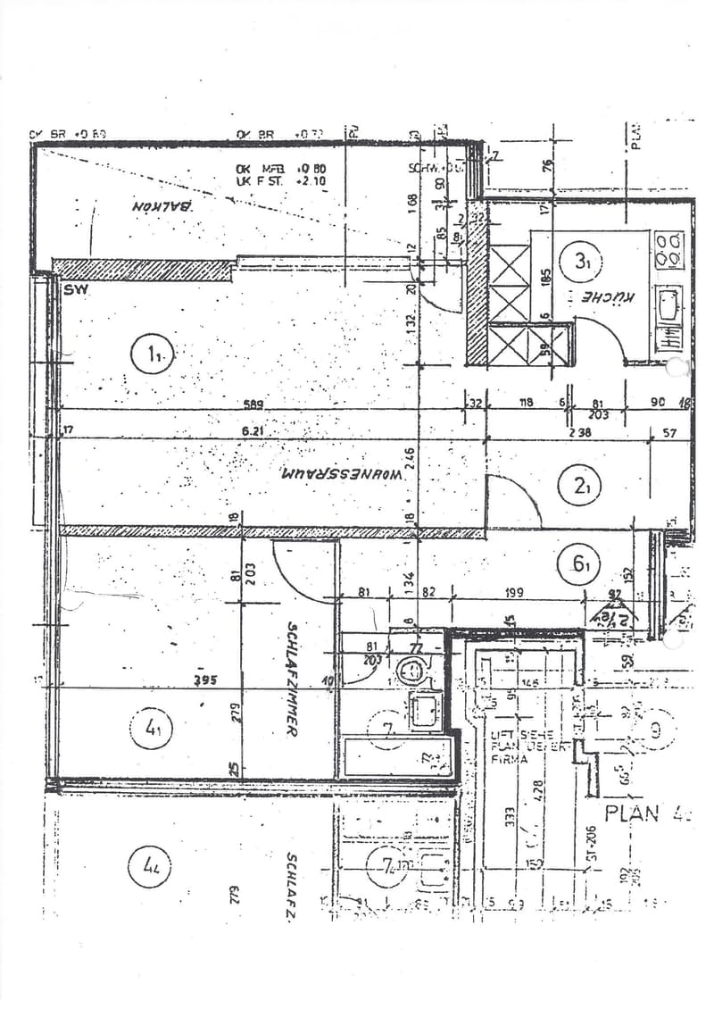 Floor plan showing multiple rooms labeled with numbers, including a kitchen, living room, bedrooms, and bathrooms. Dimensions and measurements are indicated throughout the layout.