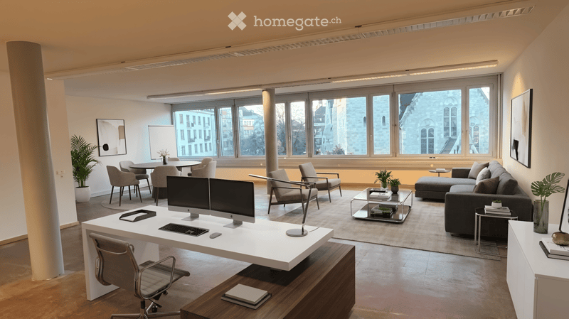 modern office with desk, chairs, monitors, couch, coffee table, plants, large windows