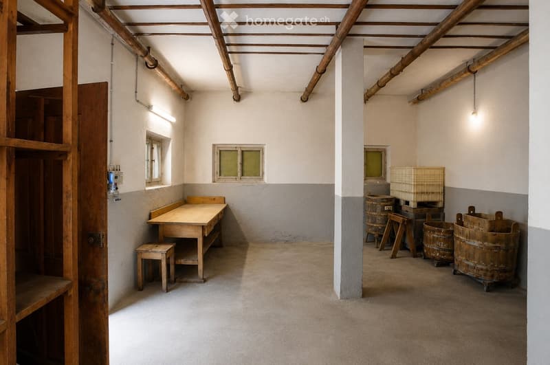 The room features exposed wooden beams on the ceiling, a wooden table with a stool, wooden barrels, and a wooden basket, with simple white walls and small windows.