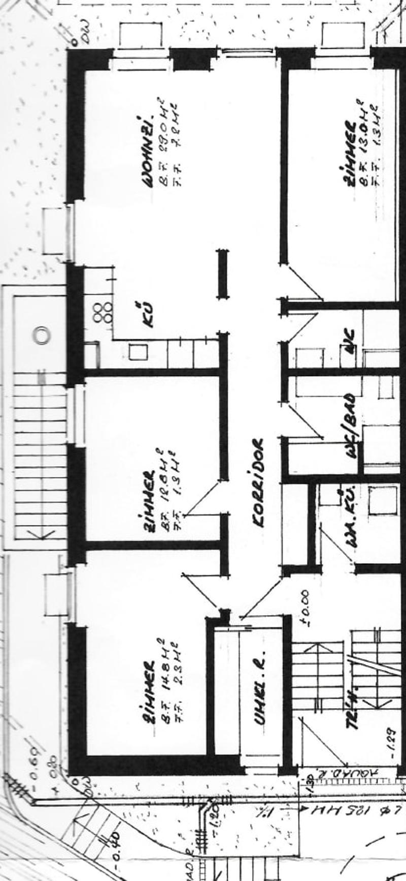 Floor plan of a residential building showing multiple rooms including living room, dining room, bedrooms, and bathrooms.