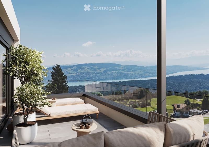 A modern balcony with a panoramic view of a lake and surrounding hills, featuring a sofa, a small table with a teapot and cups, a potted plant, and two lounge chairs.