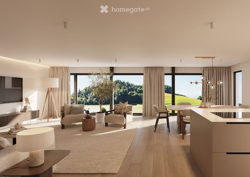 Open-plan living and dining area with large windows overlooking a green landscape, featuring a sofa, chairs, coffee table, floor lamp, television, kitchen island, and dining table.