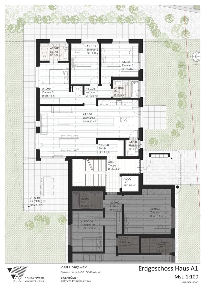 Ground floor layout of a multi-family house with labeled rooms including bedrooms, bathrooms, kitchen, living area, entrance, and stairwell.