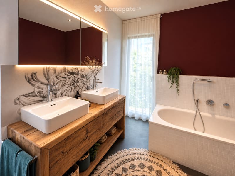Modern bathroom with two sinks on a wooden vanity, a bathtub, a large mirror with built-in lighting, and decorative plants.