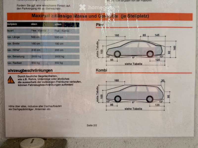 A signboard displaying parking regulations and vehicle dimensions, including tables and illustrations for cars and vans.