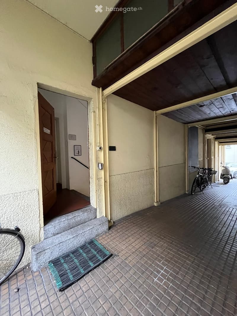 entrance hall, paved floor, bicycles, garage, parking area