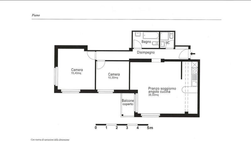 Floor plan showing a living area, two bedrooms, a kitchen-dining area, a covered balcony, a bathroom, and a WC.