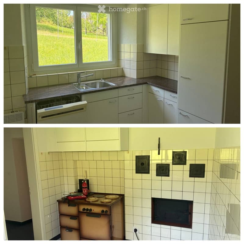 The image shows a kitchen with white cabinets, a sink with a faucet, a dishwasher, and a stove with an oven. The walls are tiled, and there is a window with a view of greenery outside.
