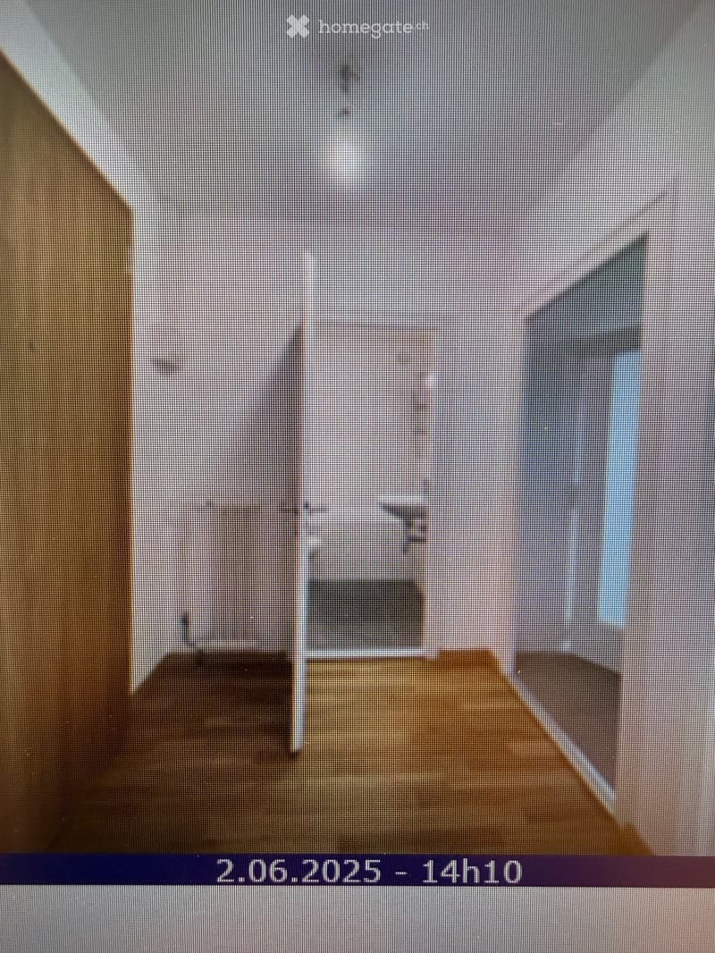 Completely empty room with bare walls and wooden floor. No furniture or equipment.