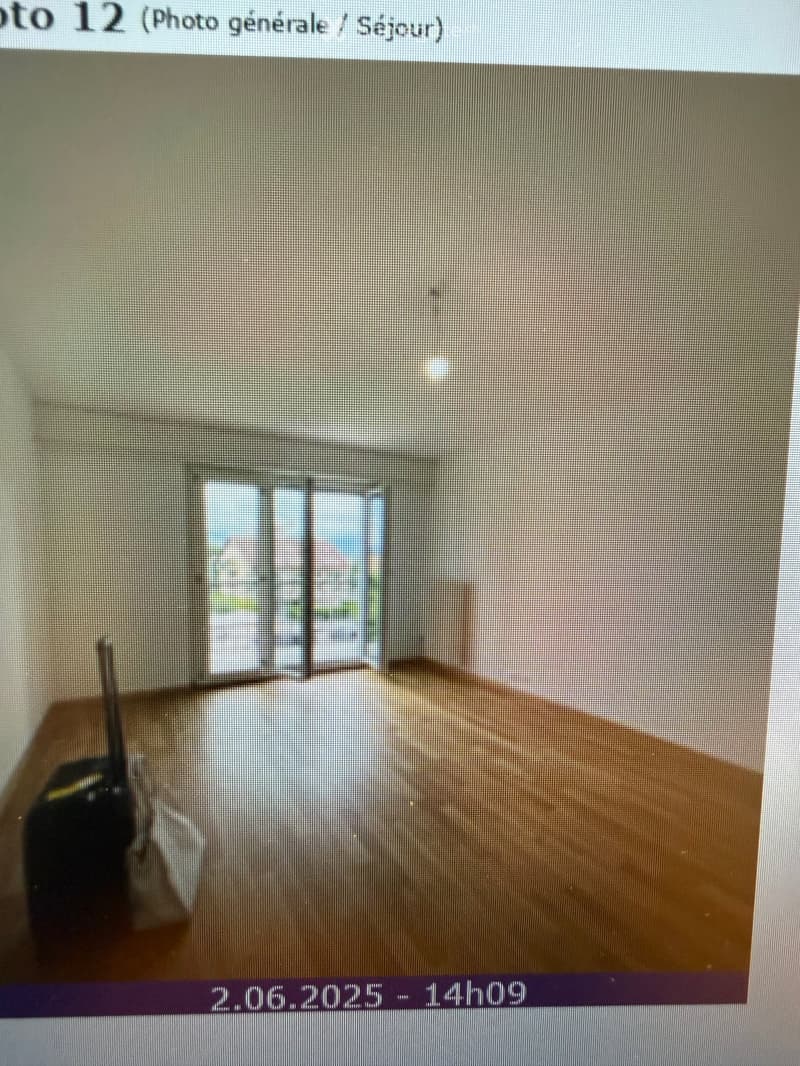 Empty room with bare walls and wooden floor, no furniture or equipment visible.