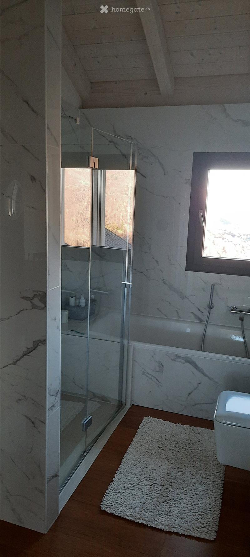 marble flooring, shower enclosure, bathtub, window, toilet, sink, white rug