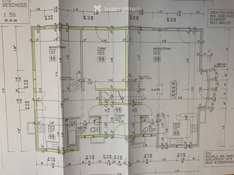 Floor plan of a two-story residential building showing living/dining area, bedroom, kitchen, bathroom, and entrance.