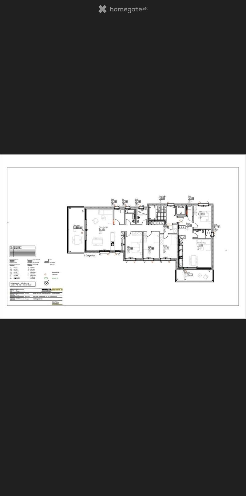 Floor plan of the first floor showing multiple rooms including living room, dining area, bedrooms, bathrooms, and kitchen.