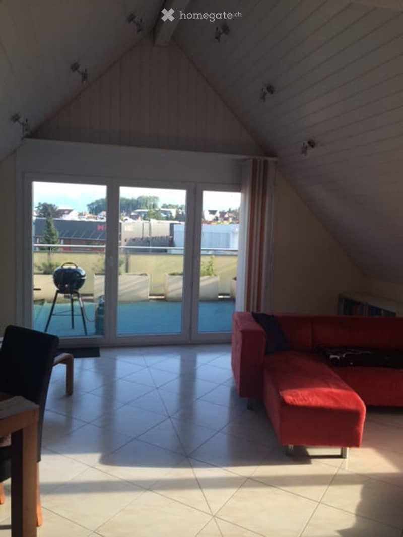 Living room: red sofa, coffee table, white tiled floor, glass sliding doors to balcony