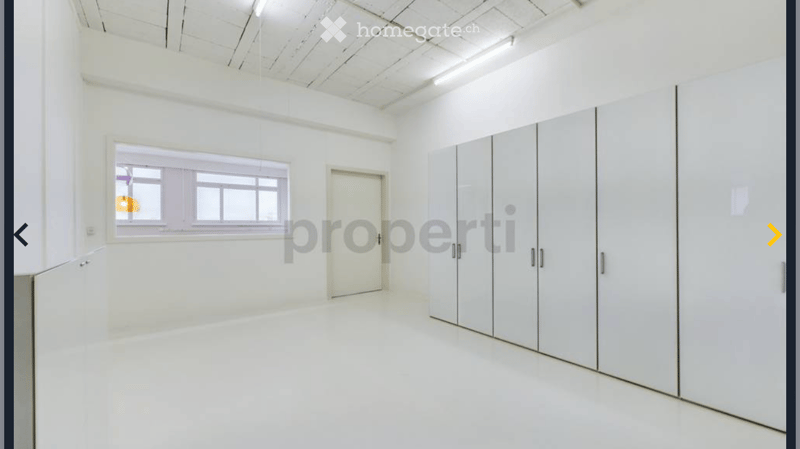 Empty room with white walls, white floor, white cabinets, window, door