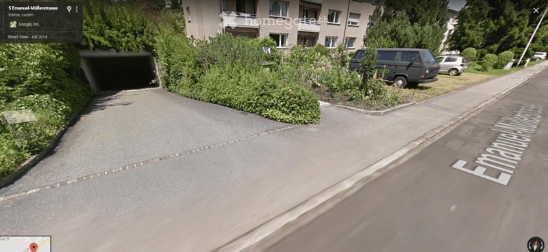 Road, parked cars, road sign, building, entrance to parking place