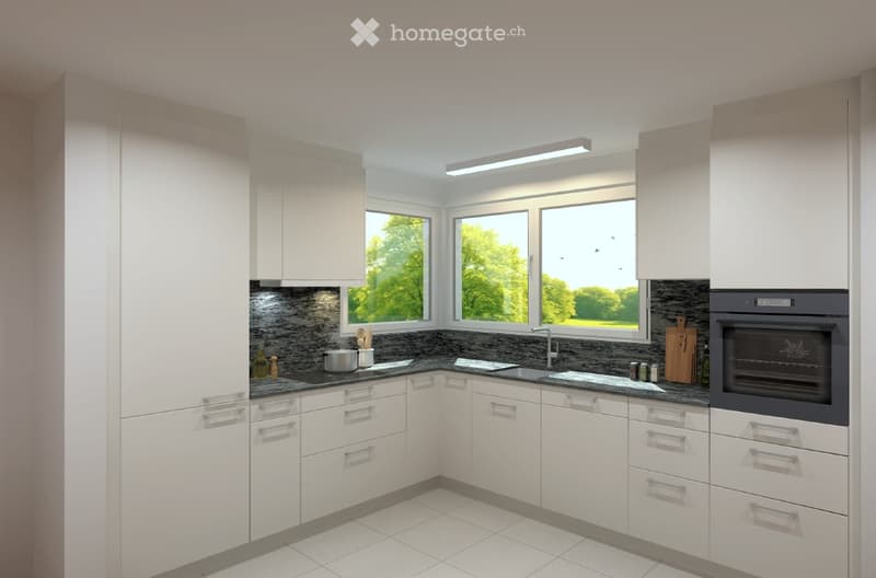 Modern kitchen with white cabinets, black countertop, stainless steel oven, and large windows overlooking greenery.