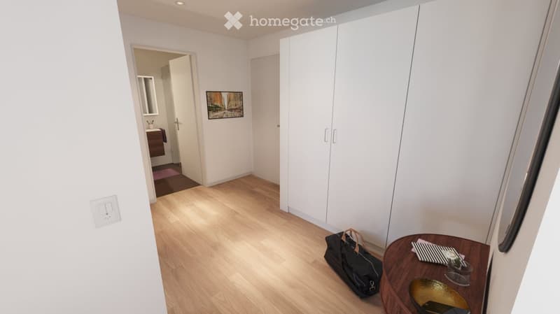 A modern, minimalistic hallway with light wooden flooring, white walls, and a large built-in wardrobe. A small round table with a handbag and decorative items is placed near the wardrobe, and a bathroom is visible in the background.