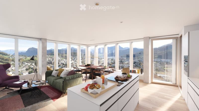 Bright, modern living and dining area with large windows offering a scenic mountain view. Features a green sofa, purple armchair, coffee table, dining table with chairs, and a kitchen island with breakfast items.