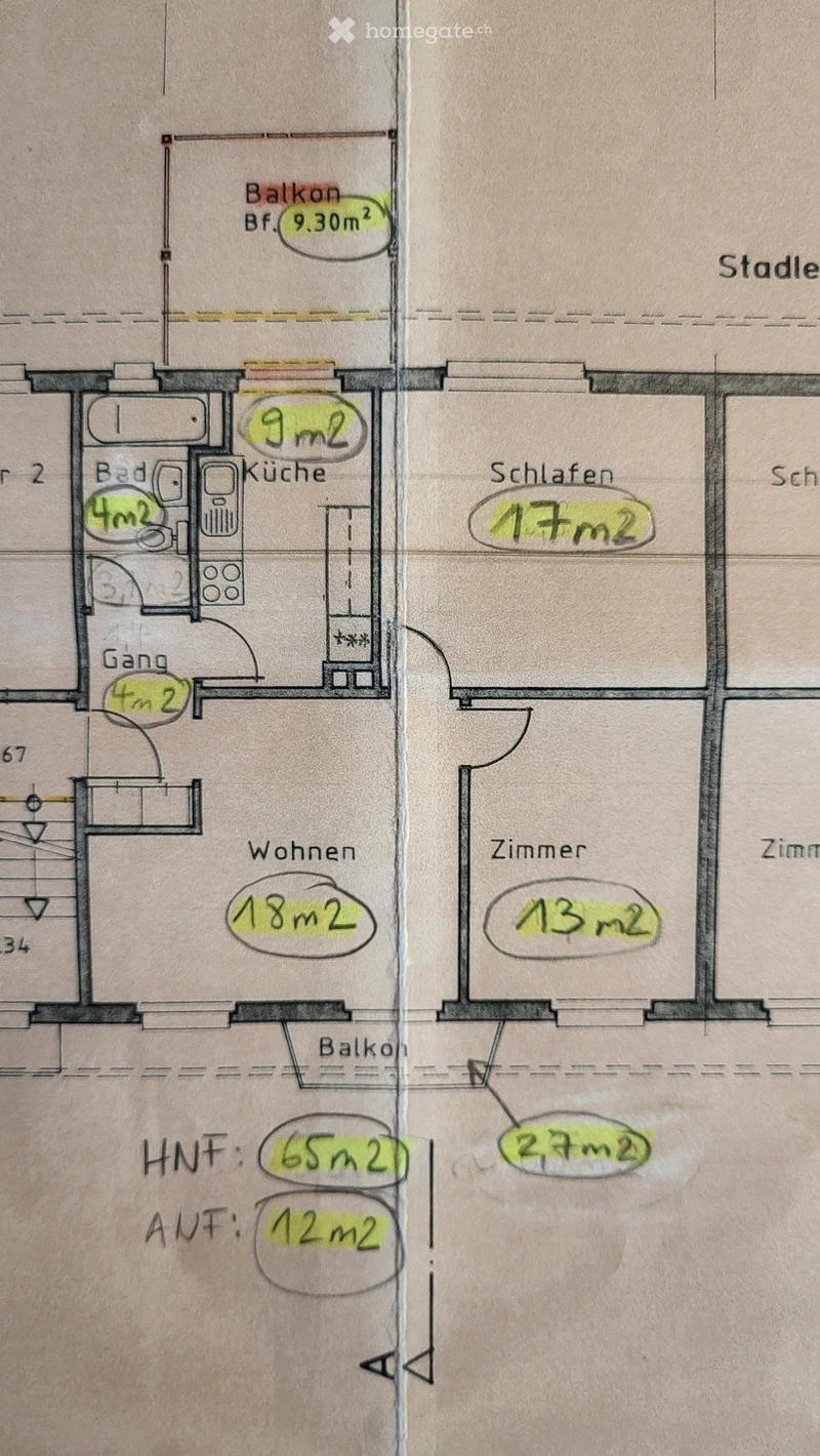 Floor plan showing a kitchen, bathroom, living area, bedroom, and balcony.