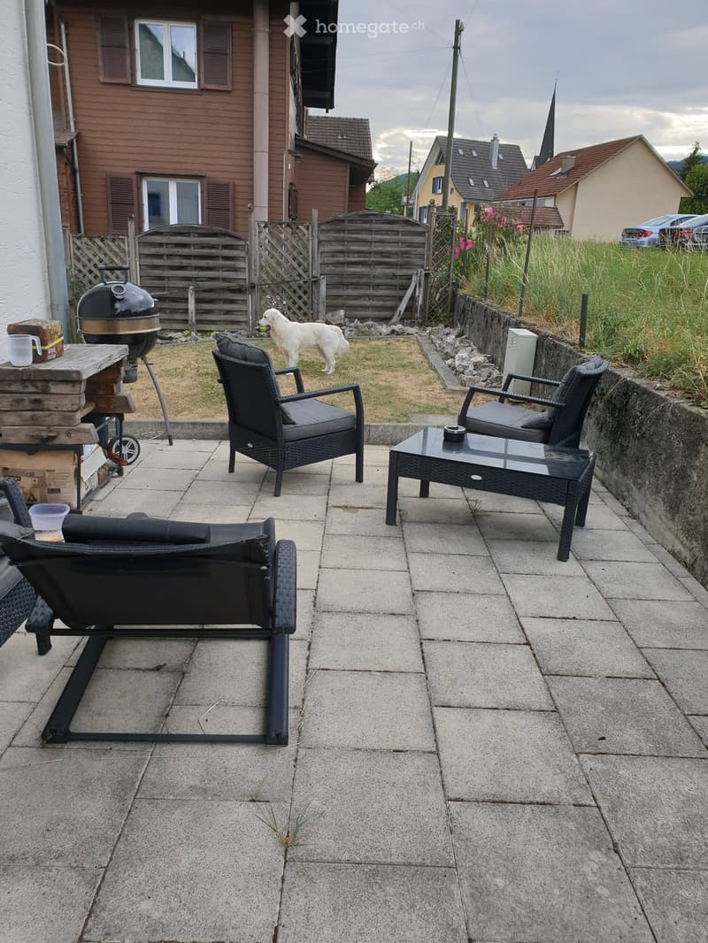 Patio area with seating and BBQ grill
