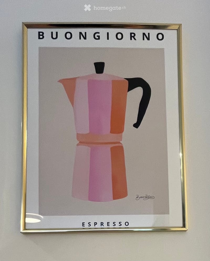 A framed artwork depicting a pink and orange espresso maker with the text "BUONGIORNO" and "ESPRESSO" displayed on a wall.