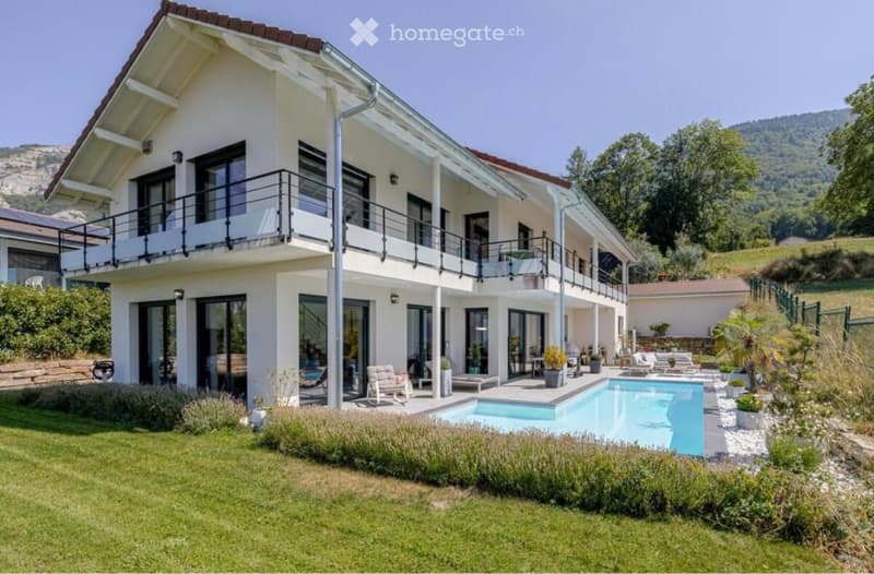 2 story house, white exterior, brown roof, large windows, balcony, swimming pool, garden, mountain view