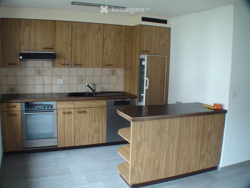 modern kitchen with a sink, dishwasher, and oven