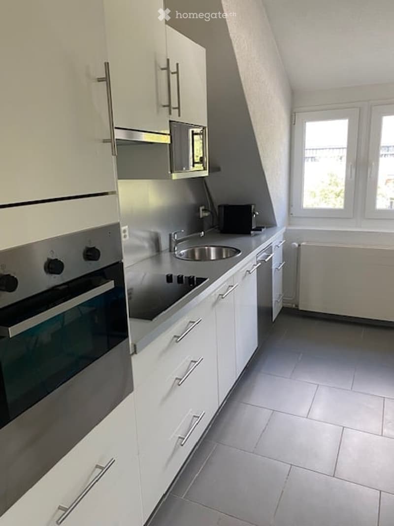 kitchen with oven, sink, dishwasher, microwave, radiator