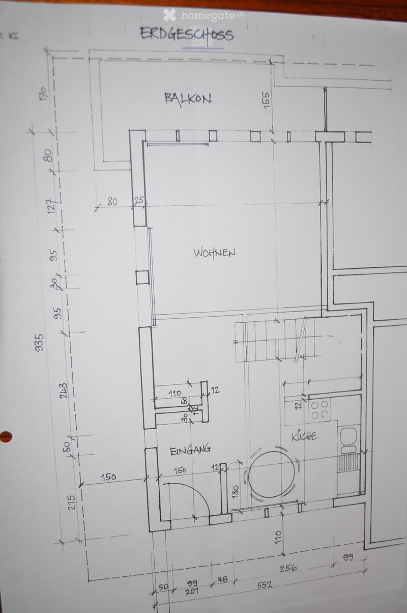 Ground floor layout showing entrance, living area, balcony, and kitchen.