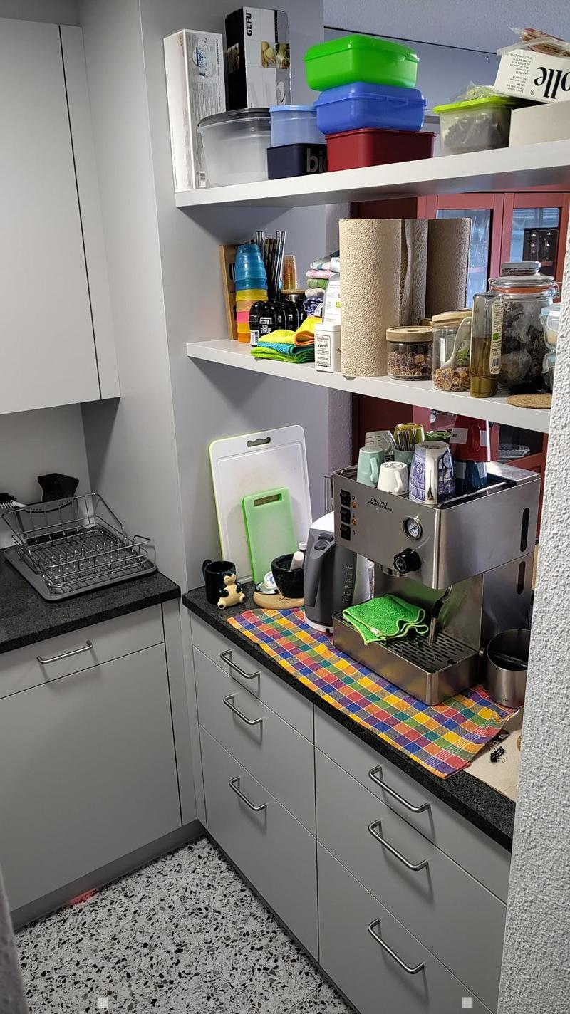 {"type": "Kitchen", "objects": ["espresso machine", "cutting board", "cup", "dish rack", "cupboard", "cupboard", "cupboard", "cupboard", "cupboard", "cupboard", "cupboard", "cupboard", "cupboard", "cupboard", "cupboard", "cupboard", "cupboard", "cupboard"