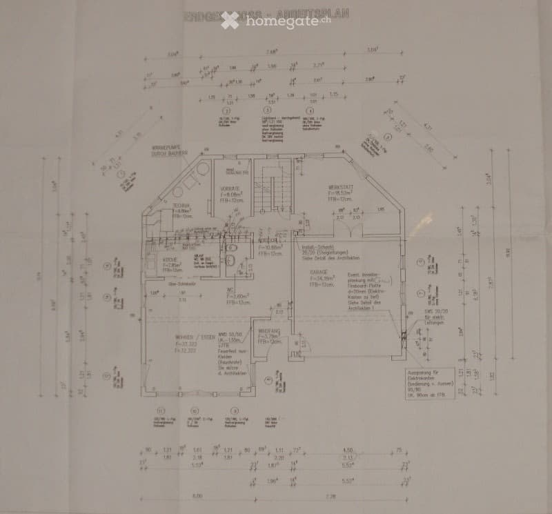 Floor plan of a building showing multiple rooms and areas including a kitchen, living room, bedrooms, garage, and technical room. Dimensions and labels are provided for each space.