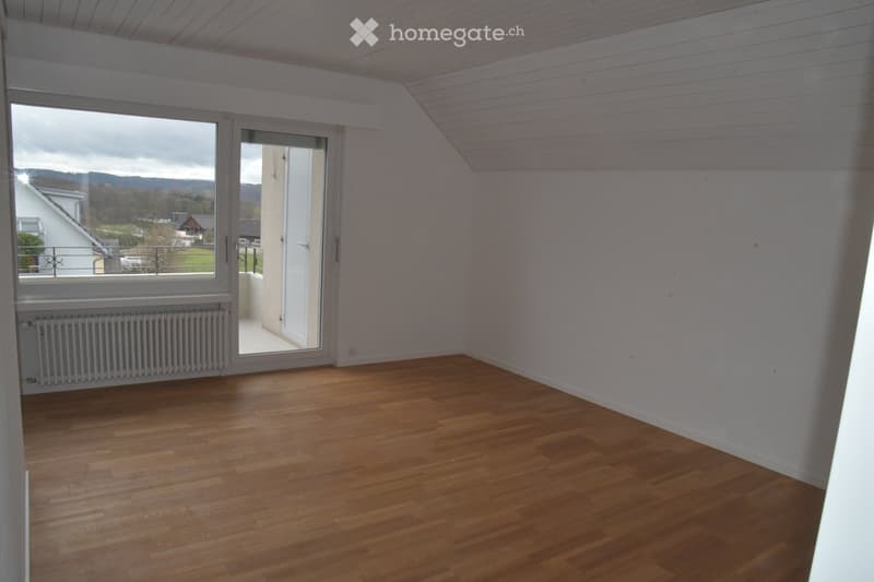 empty room, wooden floor, white walls, sliding glass door, balcony, radiator, view of the outside
