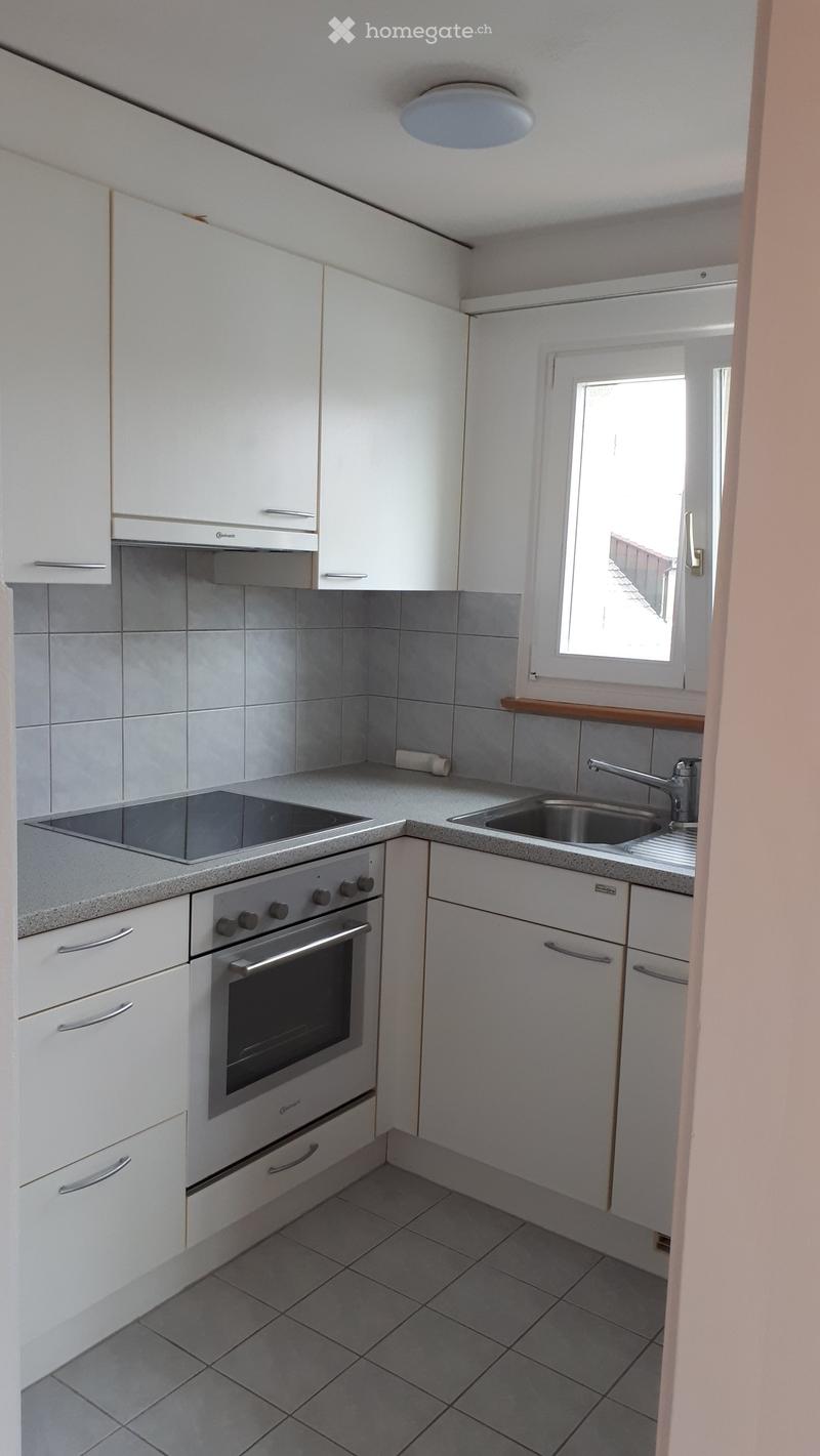 modern kitchen with white cabinets, granite countertop, stainless steel appliances, sink with faucet, window