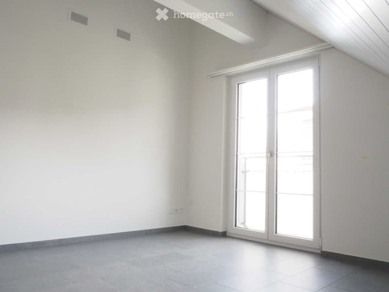 empty room, white walls, gray floor, sliding glass door, balcony