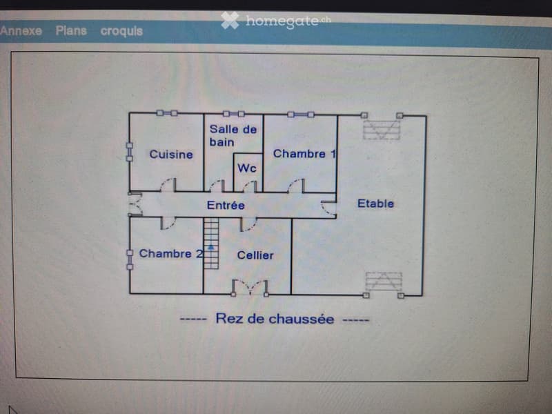 Floor plan of a ground floor showing a kitchen, bathroom, two bedrooms, living room, entrance, cellar, and WC.