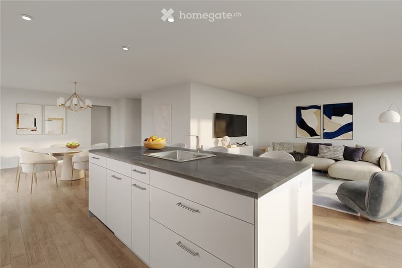 Open-plan living and dining area with modern white kitchen cabinets, a central island, a sofa, dining table, and a television mounted on the wall.