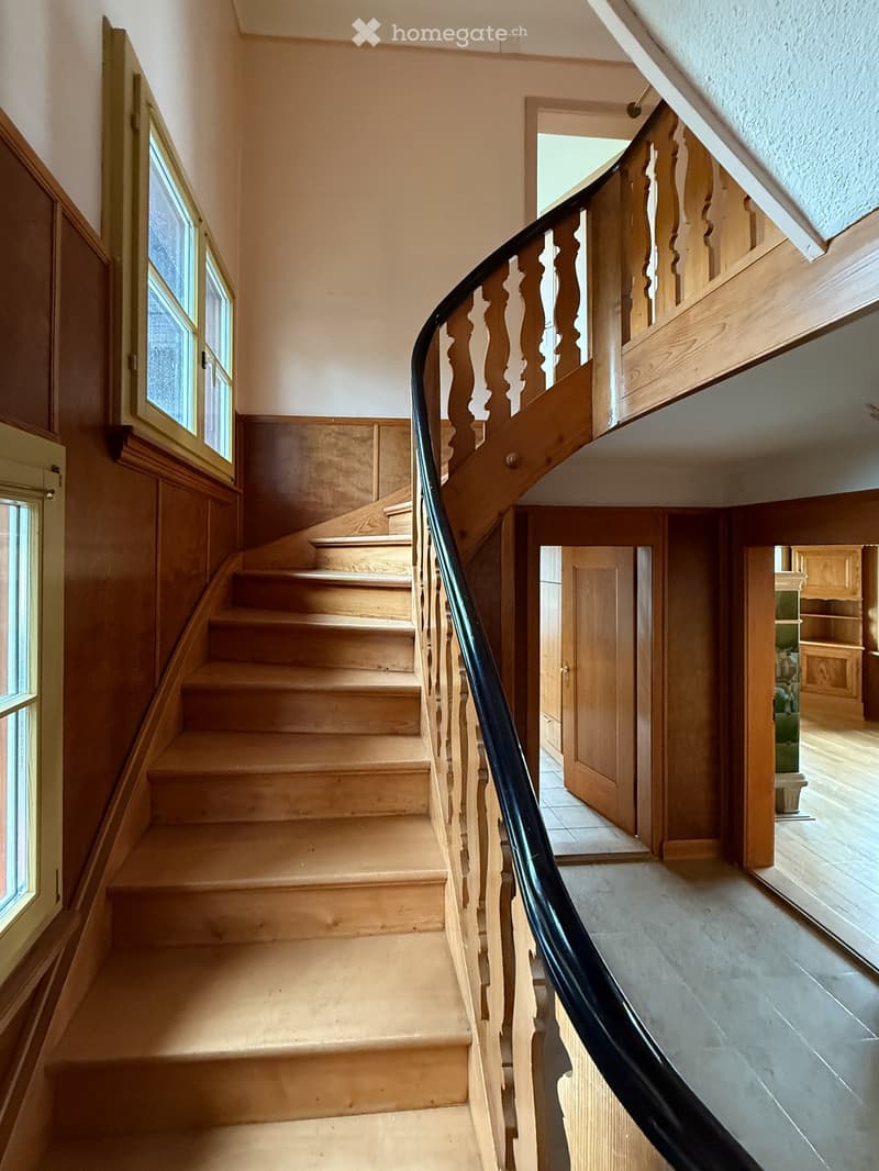 wooden stairs, wooden paneling, wooden door, windows