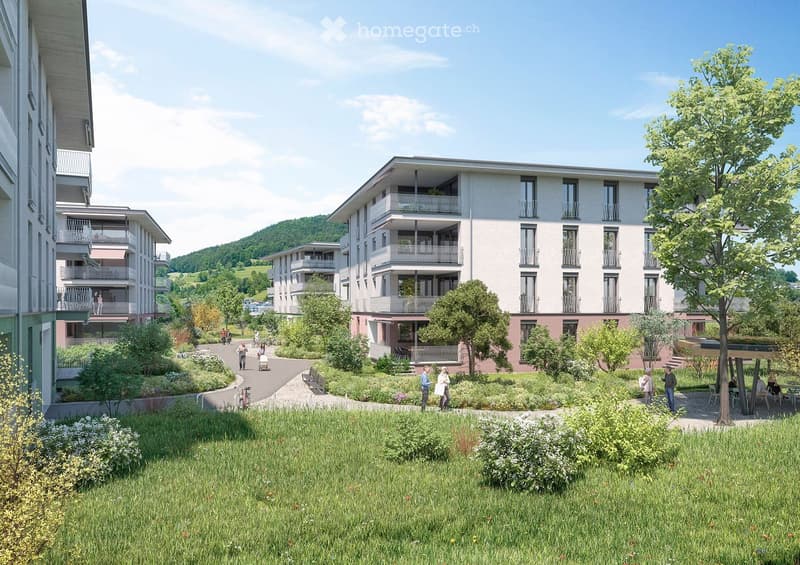 A modern apartment complex with multiple buildings, balconies, and a garden area with people walking and sitting.