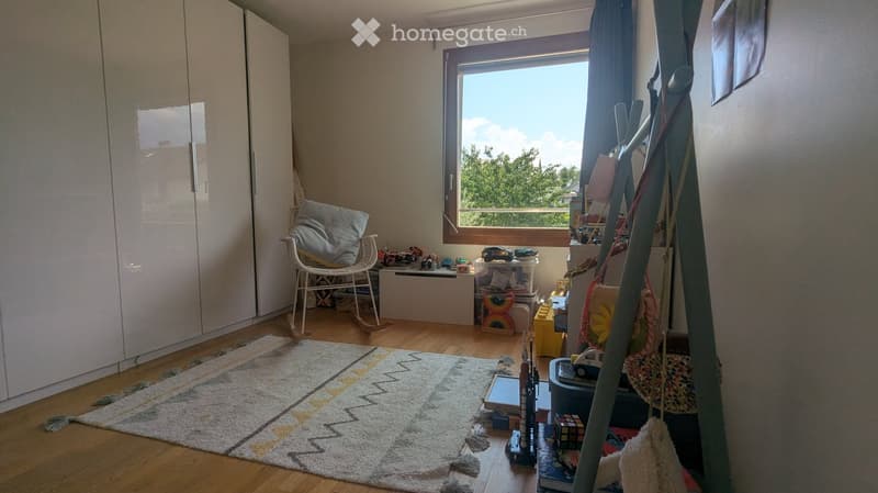 {"type": "Furnished Room", "objects": ["wardrobe", "rocking chair", "pillow", "storage box", "toy car", "toy rocket", "toy blocks", "toy cube", "toy train", "toy airplane", "toy helicopter", "toy boat", "toy motorcycle", "toy truck", "toy bus", "toy bicyc