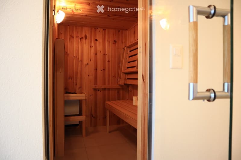 wooden walls, wooden benches, light on wall, white light switch