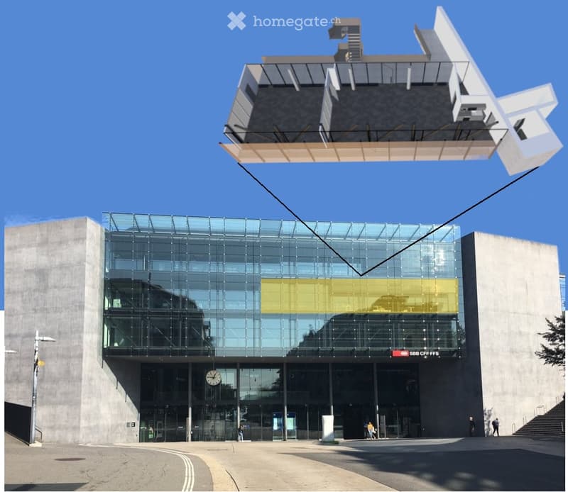 Modern building with a large glass facade and a suspended structure above, featuring a clock and signage.